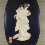 A Japanese Meiji Period carved bone picture, depicting a woman and child, with carved seal