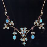 An Edwardian 9ct gold opal and ruby collar necklace, pierced floral settings with opal leaf drops,