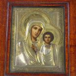 WITHDRAWN An early 20th century Russian icon in gilded and silvered metal mount, stained...
