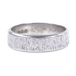 A platinum wedding band ring, with textured settings, maker's mark T&Co, hallmarks London 1978, band