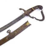 A 19th century Indian curved sword with etched blade, gilt-brass and horn-mounted handle (one horn