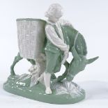 A Minton green and white glaze porcelain table centre in the form of a boy with a donkey, length