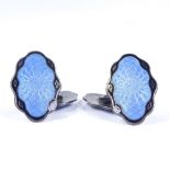 A pair of sterling silver and blue and black enamel double-sided cufflinks, with sunburst engine