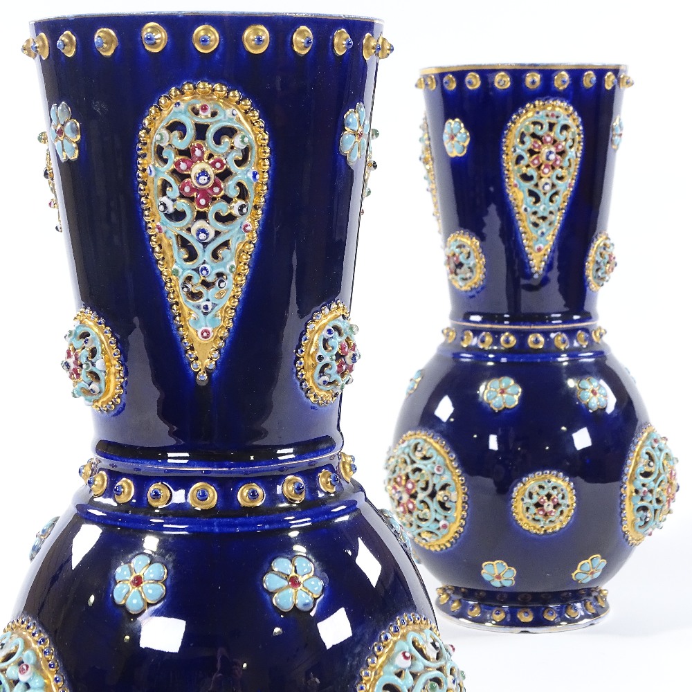 A pair of Hungarian blue glaze pottery vases, circa 1900, in the manner of Zsolnay, with pierced and