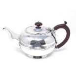A Carrington & Co silver plated circular teapot, height 13cm