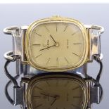 OMEGA - a lady's gold plated De Ville mechanical bangle wristwatch, champagne dial with gilt baton