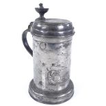 A pewter lidded tankard with engraved scene of knights in armour, height to lid 19cm