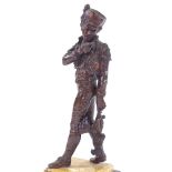 A late 19th century patinated bronze sculpture of a man carrying a cockerel, unsigned, on 2-colour