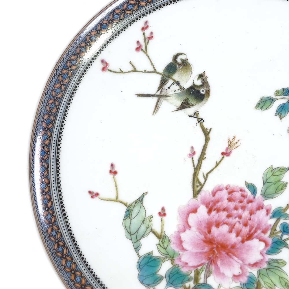 A Chinese Republic Period porcelain plate, hand painted enamel exotic birds and flowers in painted