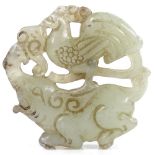 A Chinese carved and pierced jadeite elephants and cockerel design disc pendant, diameter 5cm