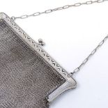 A silver plated mesh evening purse, with pierced arrow mounts, width 17cm