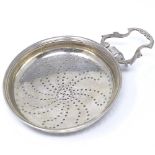 A Georgian Scottish silver lemon strainer, with pierced spiral bowl and scrollwork handle, maker's