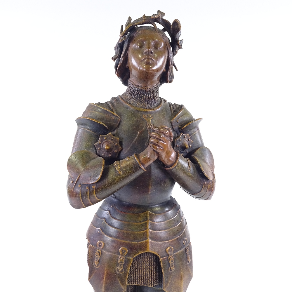 Mercie, a bronze patinated spelter figure of Joan of Arc, signed on the plinth, height 60cm