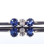 An unmarked white gold 3-stone sapphire and diamond bar brooch, settings test as 9ct, brooch