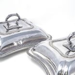 A pair of Antique silver plated entree dishes, with gadrooned rims and removable handles, length