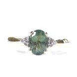 A 9ct gold green tourmaline and diamond dress ring, setting height 6.8mm, size L, 2.6g