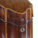 A George III mahogany and tulip wood crossbanded knife box, with shaped front and ogee bracket feet,