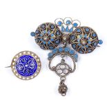 A Norwegian silver-gilt blue enamel filigree brooch, height 52.9mm, and a similar silver-gilt blue