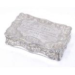 A Victorian silver rectangular snuffbox, with engraved foliate decoration and shaped border, by