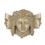 A relief carved lava cameo brooch, depicting female portrait and flanking masks, brooch length 42.