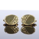 A pair of 18ct gold oval panel cufflinks, with engraved foliate decoration, maker's marks WJP, panel