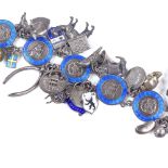 A George VI silver and blue enamel charm bracelet, including numerous various charms, maker's