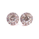 A pair of 14ct rose gold 0.57ct cognac diamond cluster earrings, with stud fittings, each central