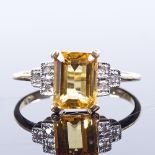 A 9ct gold citrine and diamond stepped dress ring, setting height 8.8mm, size N, 2.2g