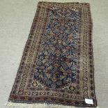 A Persian blue ground wool rug, with geometric border, 190cm x 100cm