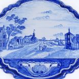 A large Delft blue and white tin glazed wall plaque, with hand painted landscape design, 59cm x 50cm