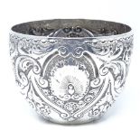 An Edwardian silver sugar bowl, with relief embossed foliate and shell decoration, by Josiah