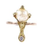 An unmarked gold pearl and diamond claw ring, setting height 21.4mm, size L, 3.4g