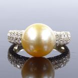 A 14ct gold cultured South Sea pearl dress ring, with diamond cluster shoulders, total diamond