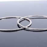 A pair of Danish sterling silver slimline bangles, by Ray Urban for Fausing, band width 1.1mm,