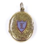 A Victorian 9ct gold locket pendant, with intaglio carved shield-shaped sardonyx seal, within a