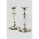 Pair of George V silver candlesticks, by Barker Bros., Chester 1924, each having removable nozzle