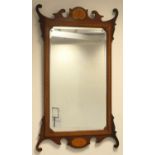Mahogany and inlaid fretwork wall mirror, the bevelled glass rectangular plate bordered with inlay