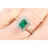 Emerald and diamond ring in Art Deco style, rectangular cut emerald of approx. 1ct bordered with