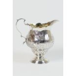 George III silver cream jug, London 1767, baluster form later engraved with a pastoral scene of a