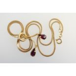 18ct gold garnet pendant necklace, the 'wheat ear' box shaped chain united by a ring and with two