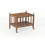 Victorian oak magazine rack, circa 1885, of cage construction, with reeded bars, turned finials