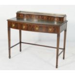 Lady's mahogany writing table, in the Chippendale style, the back fitted with a bank of four small