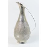 Indian silver wine jug, mid 20th Century, pear shaped with an inscription on the neck 'Habib Bank