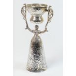 Dutch silver wager cup, late 19th Century, traditional form modelled as a lady in a crinoline worked