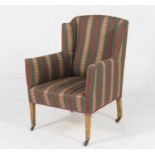 Late Victorian upholstered tub chair, circa 1890, with slight wing back, deep seat, upholstered