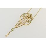 Edwardian peridot and pearl pendant necklace, in Secessionist style, the teardrop shaped openwork