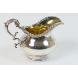 William IV silver milk jug, maker D*S, Sheffield 1832, plain baluster form with gadrooned collar,