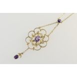 Edwardian 9ct gold gem set openwork pendant necklace, centred with an oval cut amethyst bordered