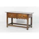 Rare early Georgian elm low dresser, circa 1720-40, the single plank top with moulded edge and of