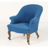 Victorian walnut and upholstered tub chair, the round back and seat upholstered in blue fabric,